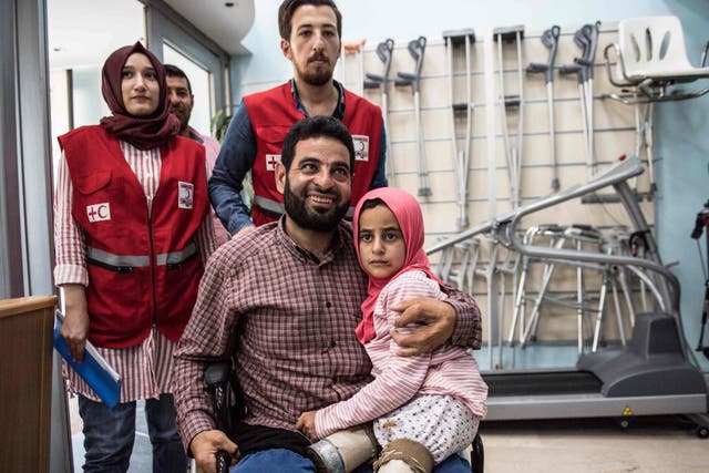 Maya and her father, both born without legs, at the Istanbul clinic where they will be given new limbs