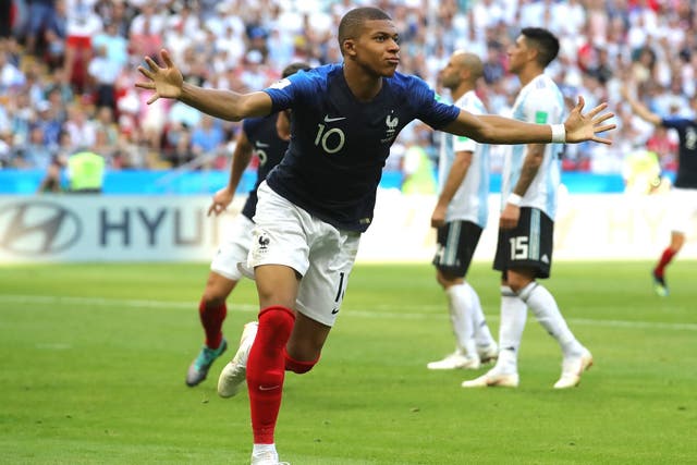 Kylian Mbappe of France celebrates after scoring his team's third goal