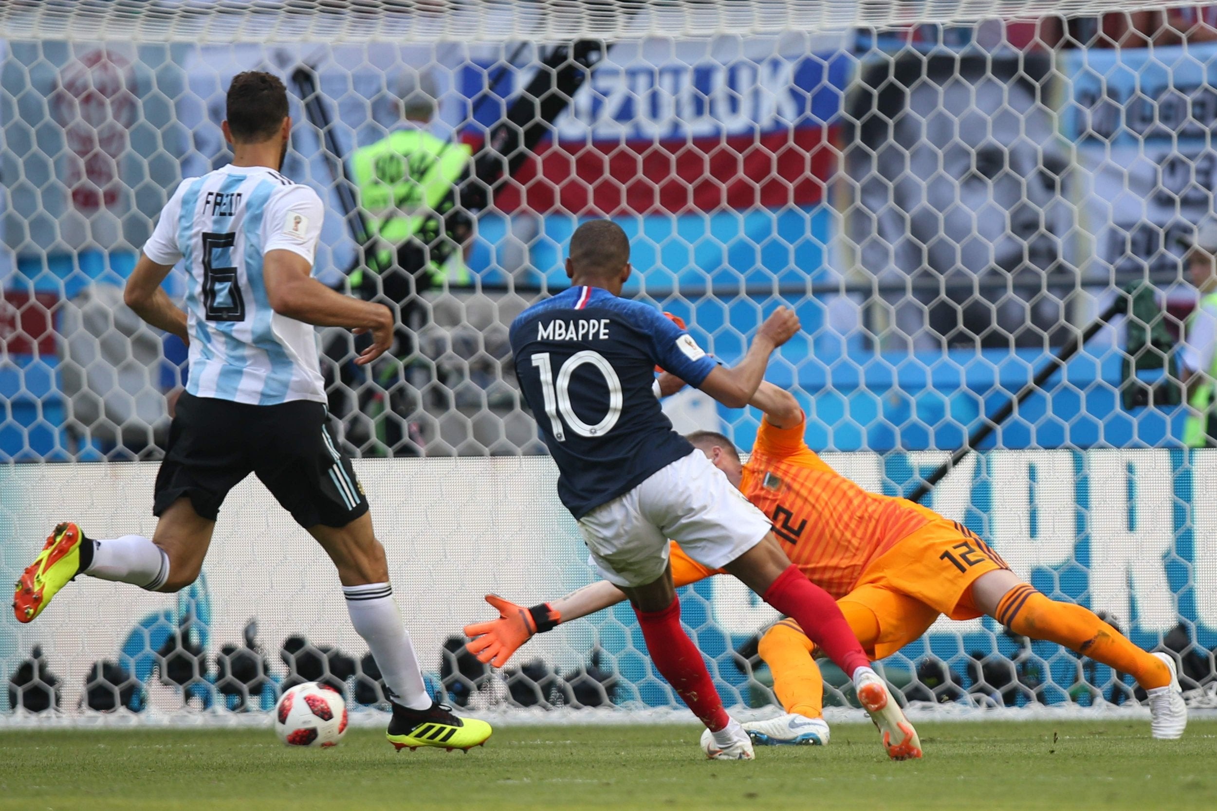 Kylian Mbappe (C) scores his team's fourth goal