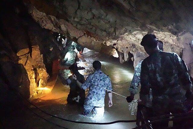 Thai Navy SEAL divers inspect the flooded tunnel in the Tham Luang cave.