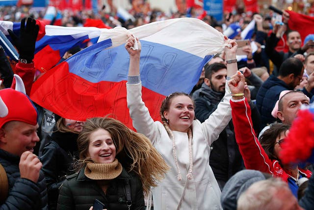 Party time: Russian fans celebrate their victory over Spain