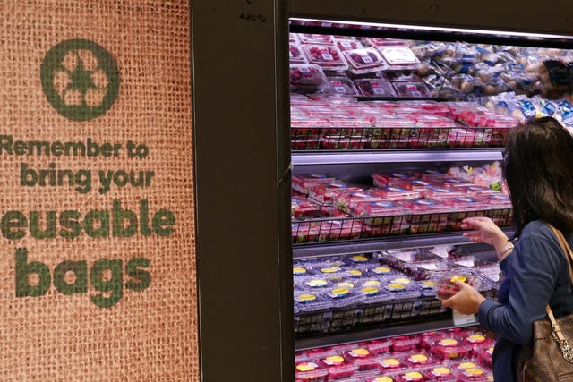 Shoppers at a plastic bag-free Woolworths supermarket are encouraged to bring reusable bags