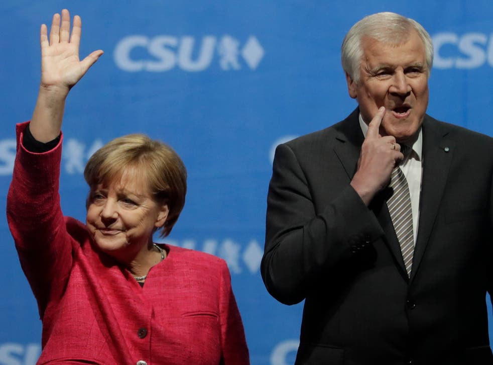 Horst Seehofer (right) has offered to resign as interior minister