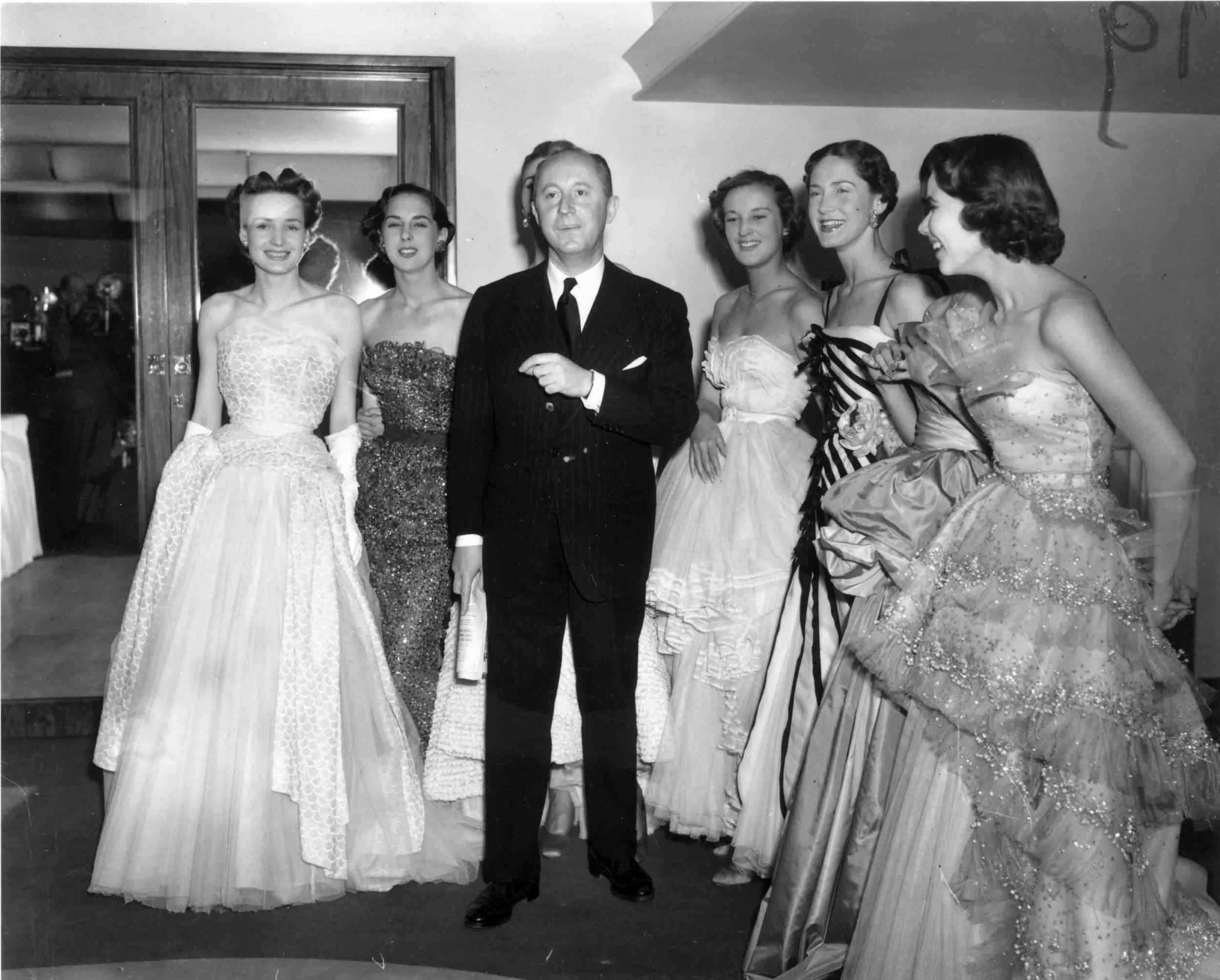 Dior with his models after a London show in 1950 (Getty)