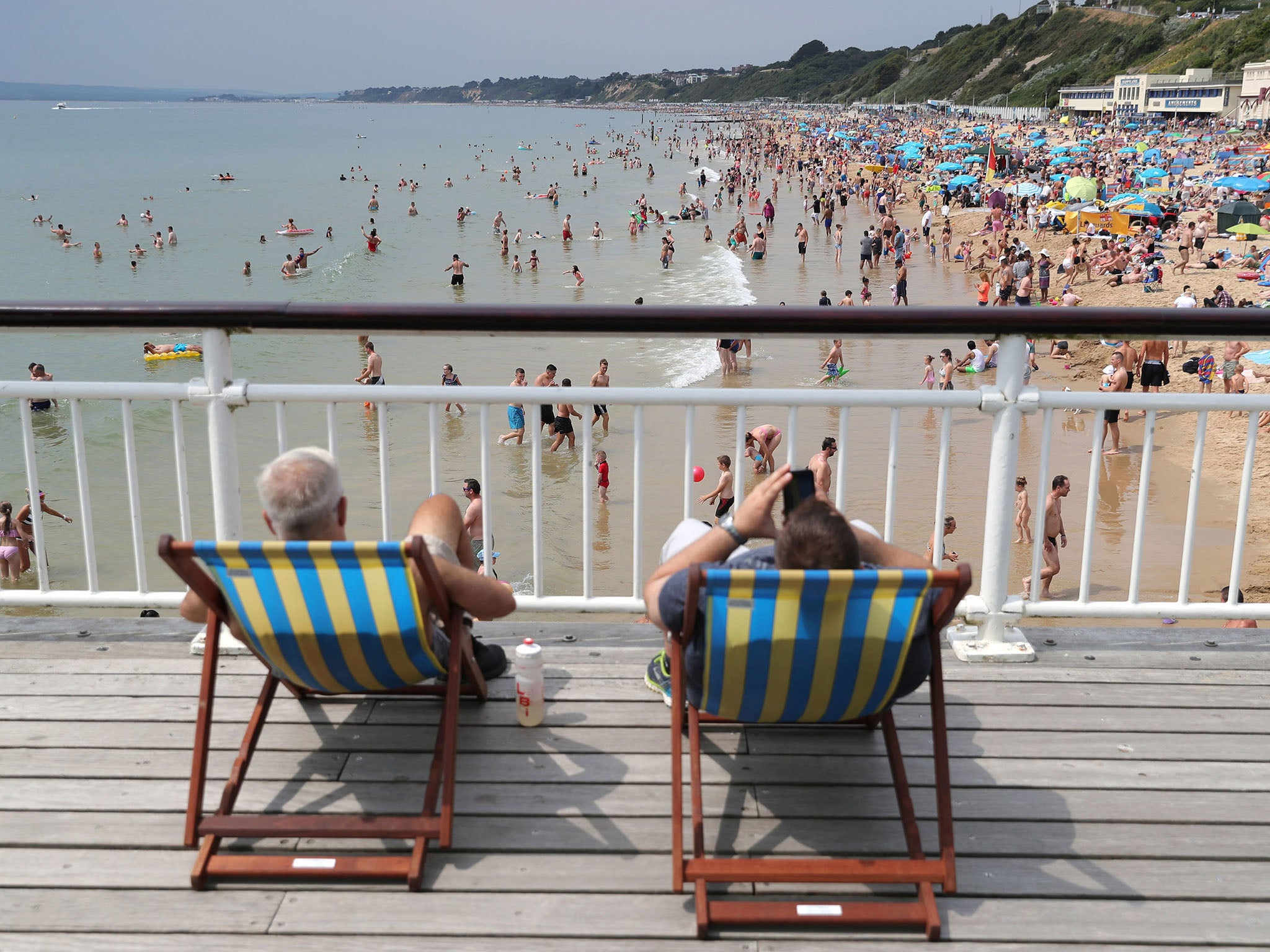 People on Bournemouth beach, Dorset as the hot weather continues across the country