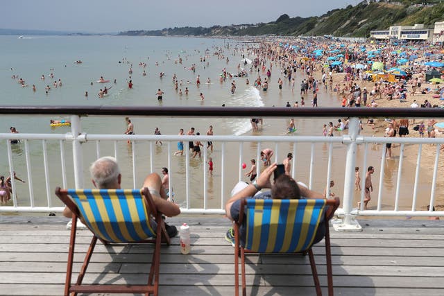 People on Bournemouth beach, Dorset as the hot weather continues across the country