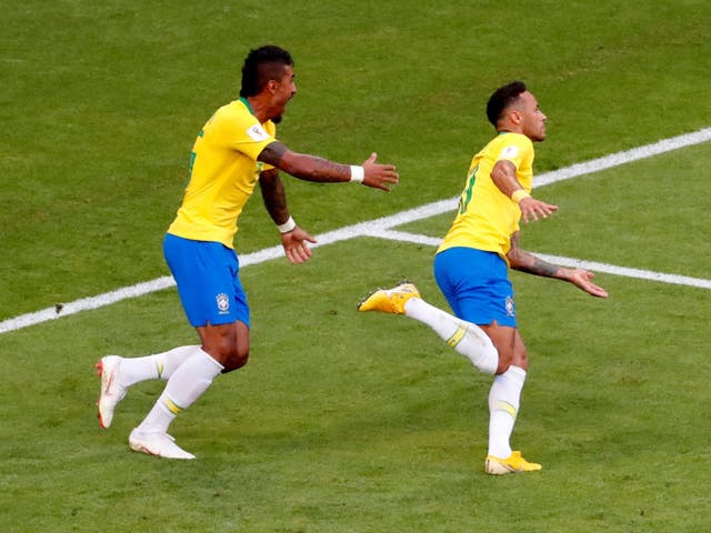 Brazil's Neymar celebrates with Paulinho after scoring their first goal