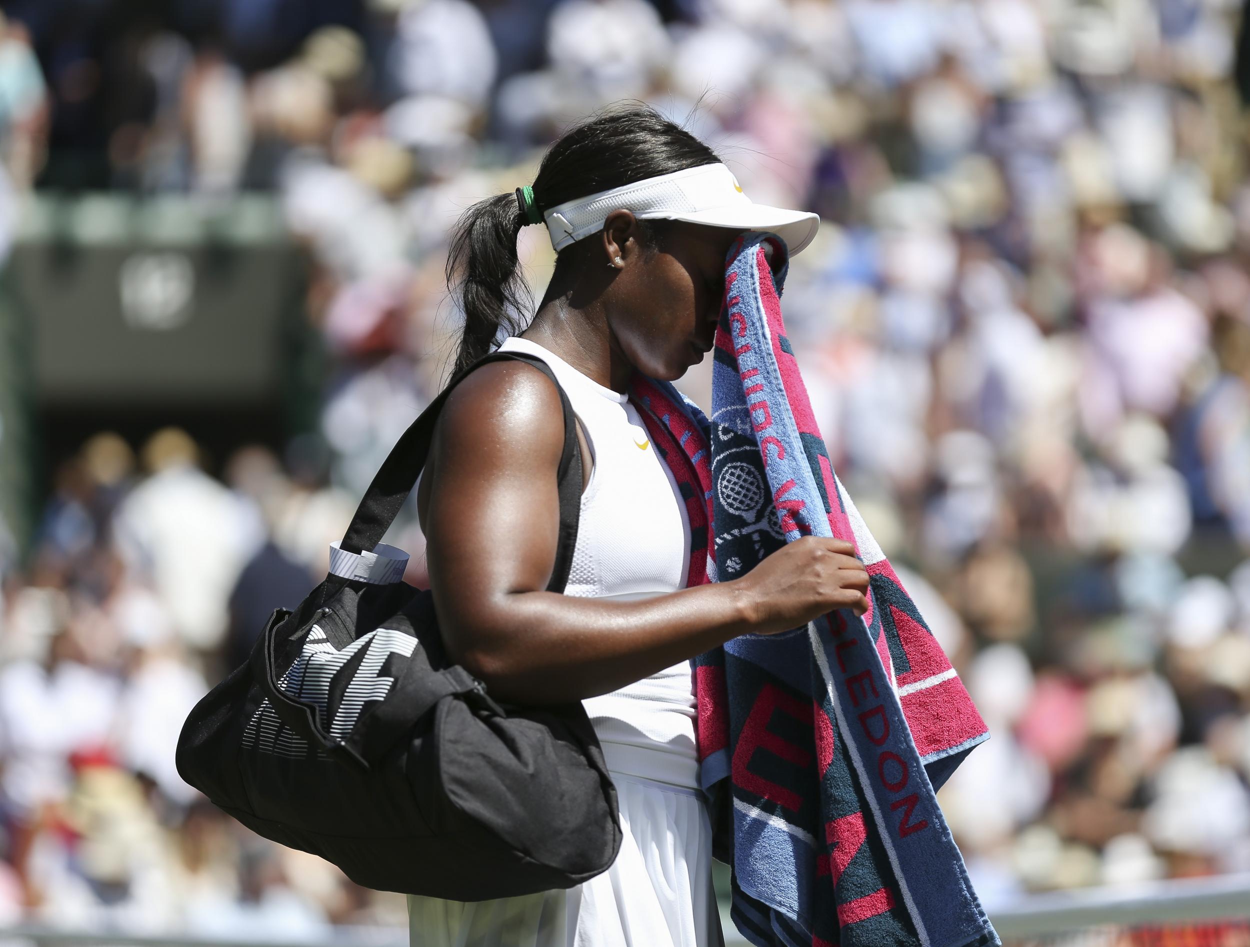 The American leaves with her head in her hands after the shock defeat