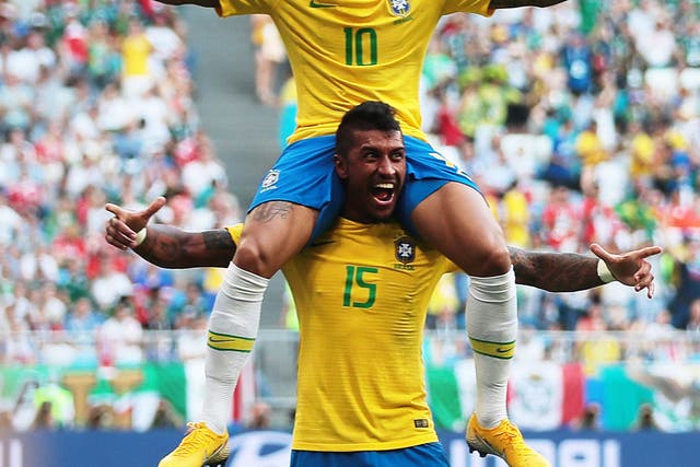 Neymar and Paulinho of Brazil celebrate