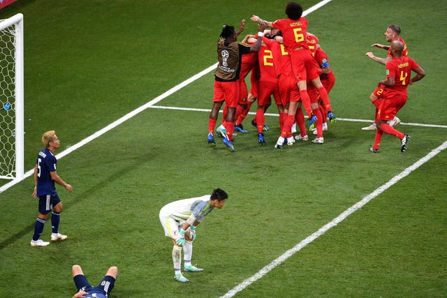 Nacer Chadli of Belgium celebrates after scoring his team's third goal with team mates