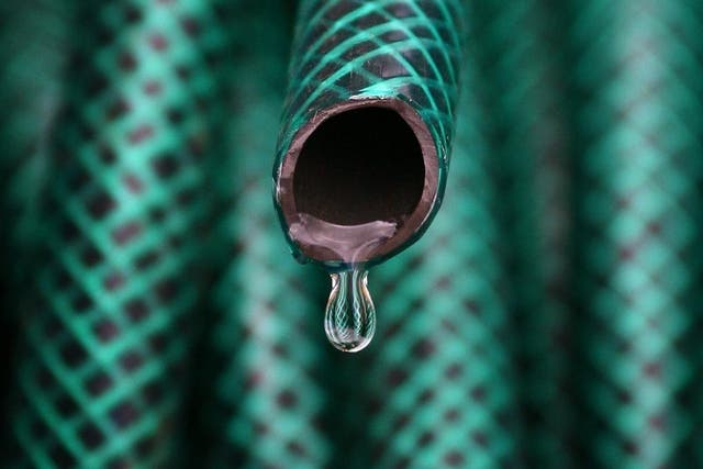 Water dripping from a hosepipe as water companies have asked customers to conserve supplies by not using hosepipes or water sprinklers