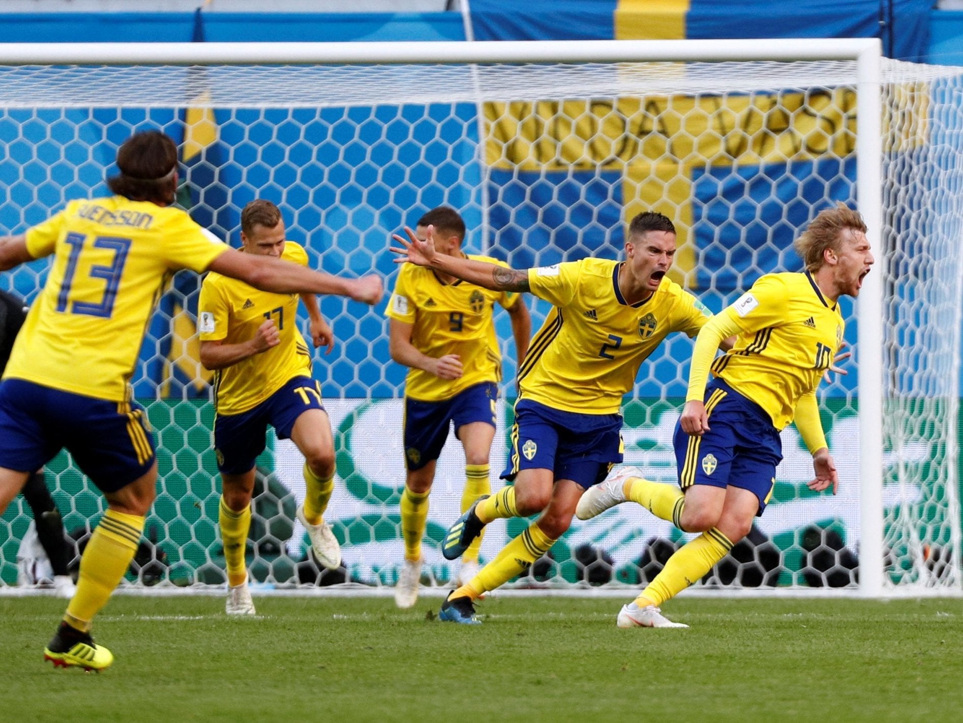 Sweden's Emil Forsberg celebrates scoring their first goal with teammates