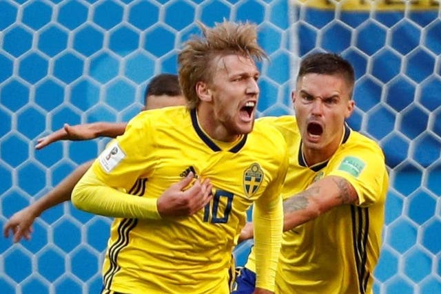 Sweden's Emil Forsberg celebrates scoring their first goal with team mates