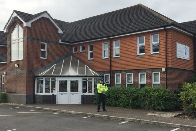 A police officer stands outside Amesbury Baptist Church in Wiltshire