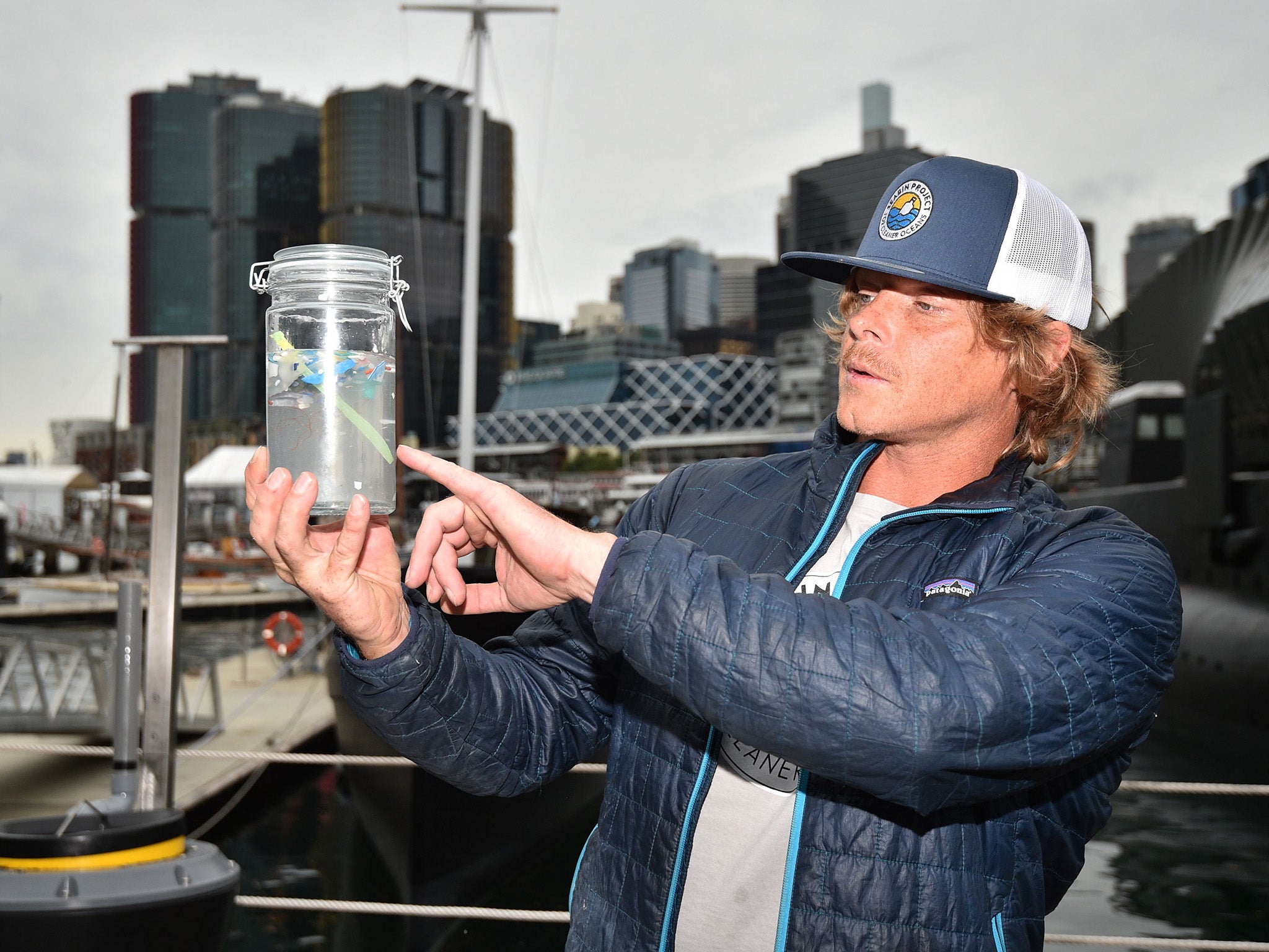 Pete Ceglinski, CEO and co-founder of Seabin Project, displays microplastics collected in the 'seabin' which sucks in rubbish from the water