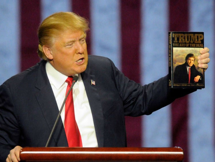 President Trump brandishing his favourite book
