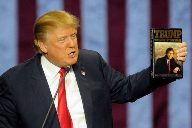 President Trump brandishing his favourite book