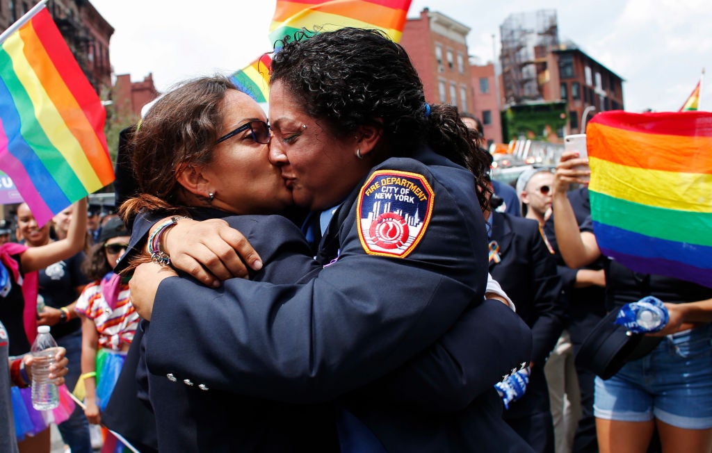 EMT Trudy Bermudez and paramedic Tayreen Bonilla of New York City Fire Department get engaged at the annual Pride Parade on June 24, 2018 in New York City