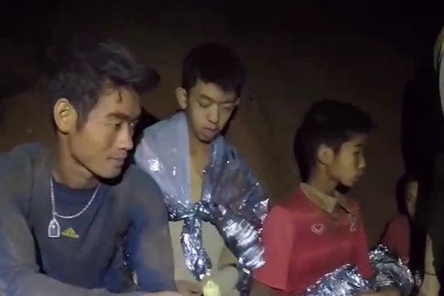 A video grab handout made available by Thai Royal Navy shows some of the members of a trapped team