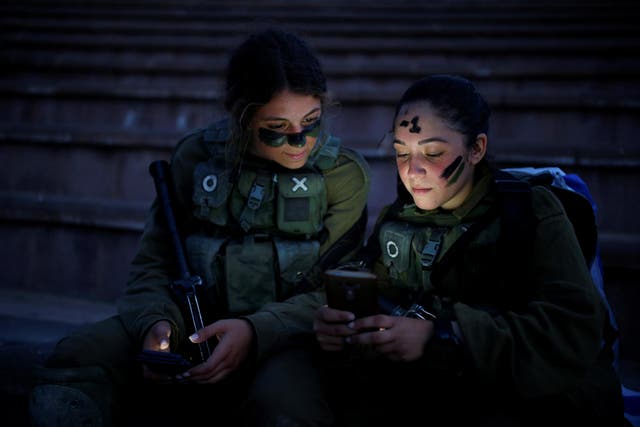 Israeli Search and Rescue brigade soldiers rest during a training session in Ben Shemen forest, near the city of Modi'in, on 23 May 2016