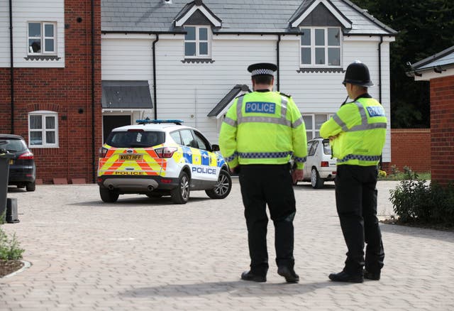 Police activity outside a block of flats on Muggleton Road in Amesbury, Wiltshire, where a couple were poisoned with a nerve agent