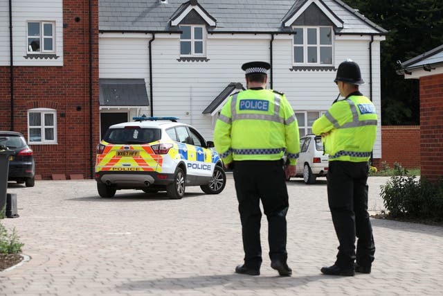 Police activity outside a block of flats on Muggleton Road in Amesbury, Wiltshire, where a couple were poisoned with a nerve agent