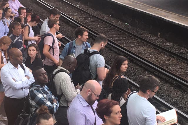 Waiting game: commuters at Clapham Junction station during disruption on Wednesday