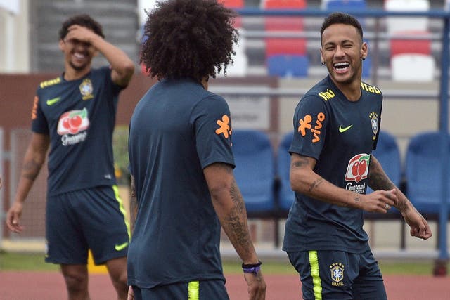 Brazil's Neymar smiles during a training session