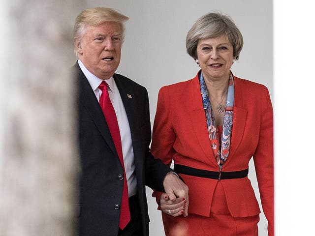 Theresa May was criticised for appearing in public holding hands with Donald Trump when they met last year