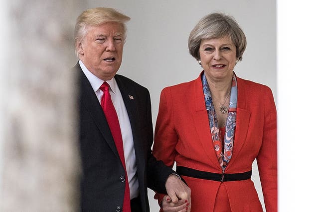 Theresa May was criticised for appearing in public holding hands with Donald Trump when they met last year