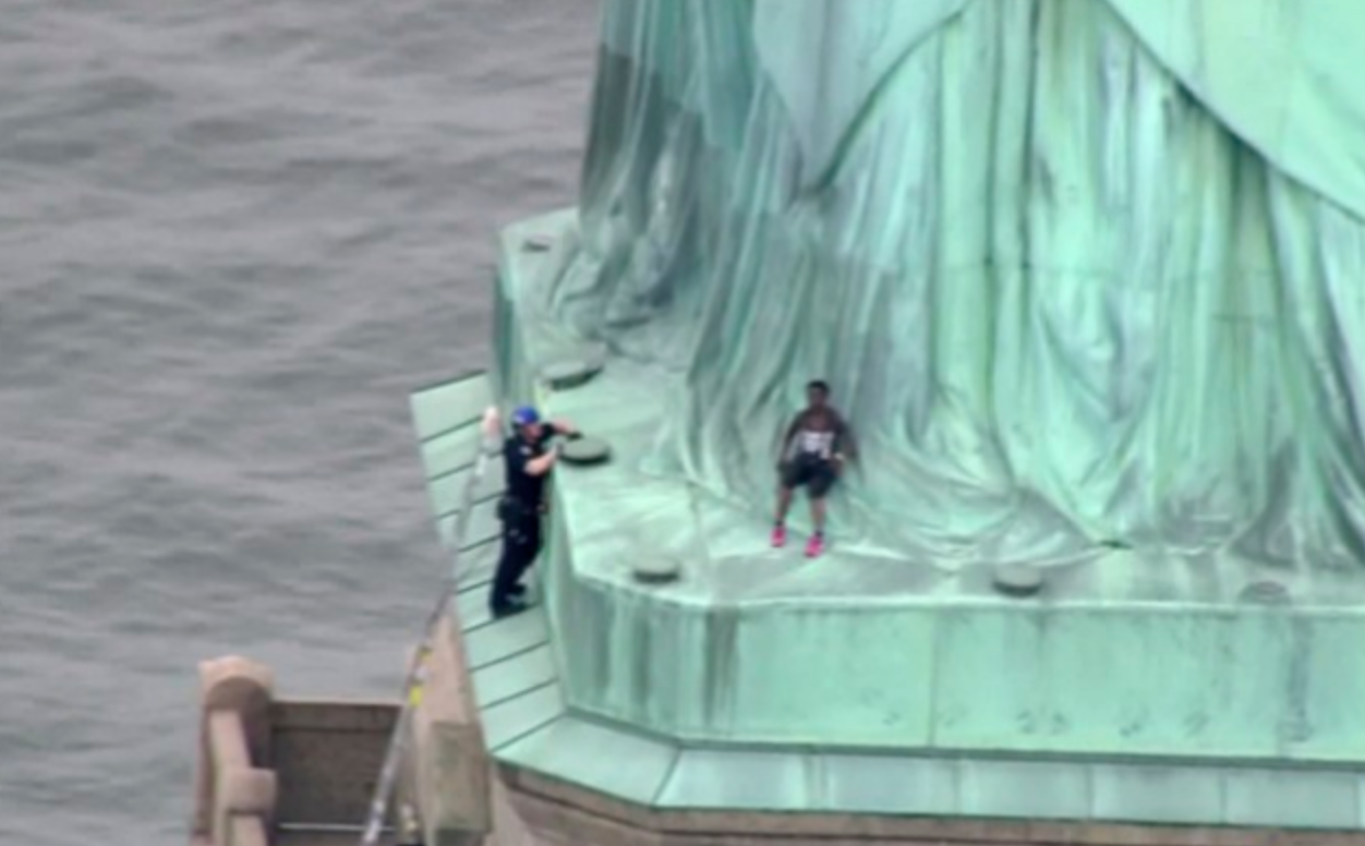 Woman who climbed Statue of Liberty to protest family separations is arrested