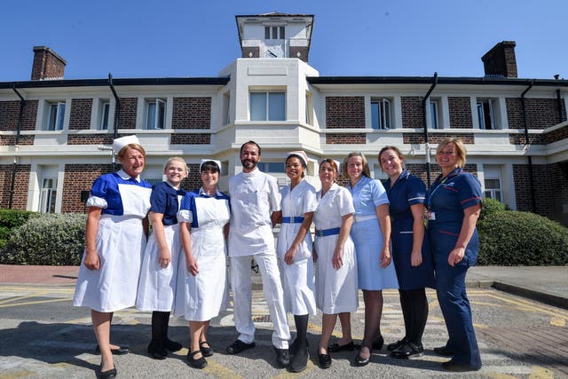 Nurses in uniforms to represent each decade of the NHS pose outside Trafford Hospital to celebrate the 70th birthday of the NHS at Trafford Hospital, birthplace of the NHS