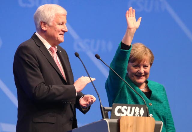 Angela Merkel and Horst Seehofer at a party meeting in December