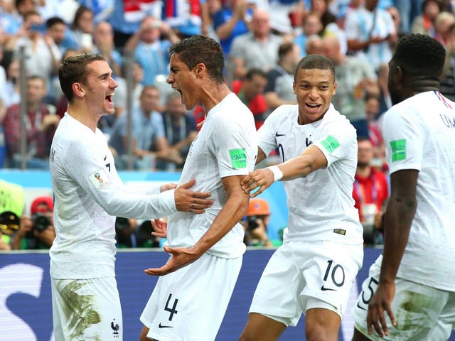 Raphael Varane of France celebrates with teammates