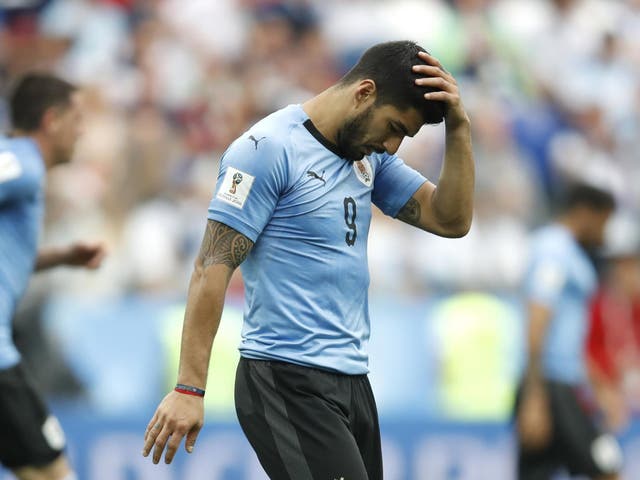 Luis Suarez reacts after France scored their second goal