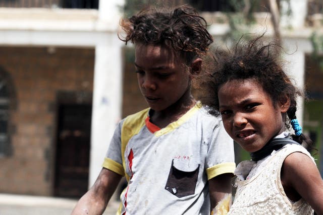 Children who fled the Yemeni city of Hodeidah are seen at a displaced temporary shelter on 1 July 2018