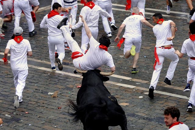 Man knocked over during last year's bull running festival in Pamplona