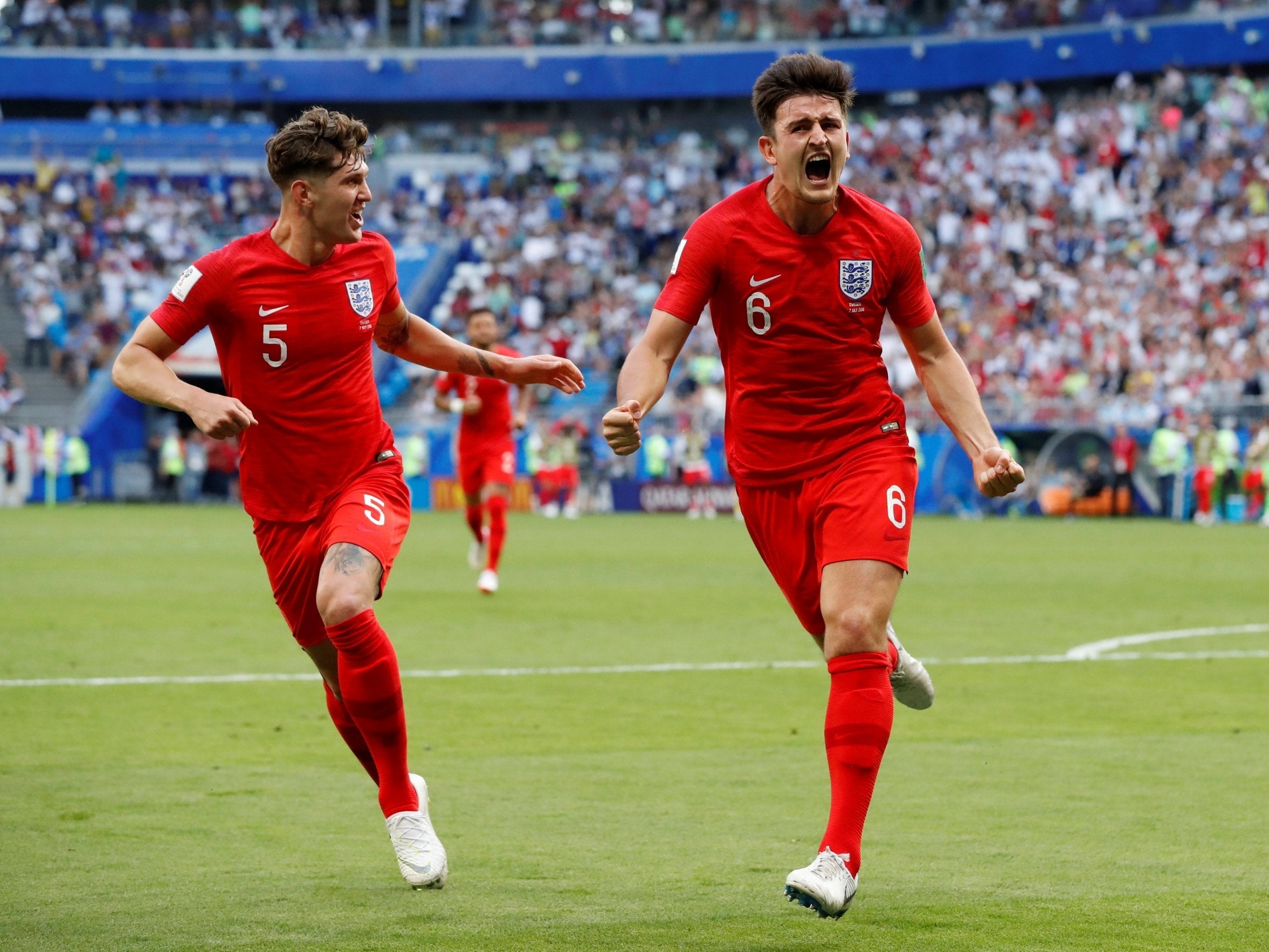 England's Harry Maguire, who grew up in Sheffield, celebrates scoring the first goal with John Stones