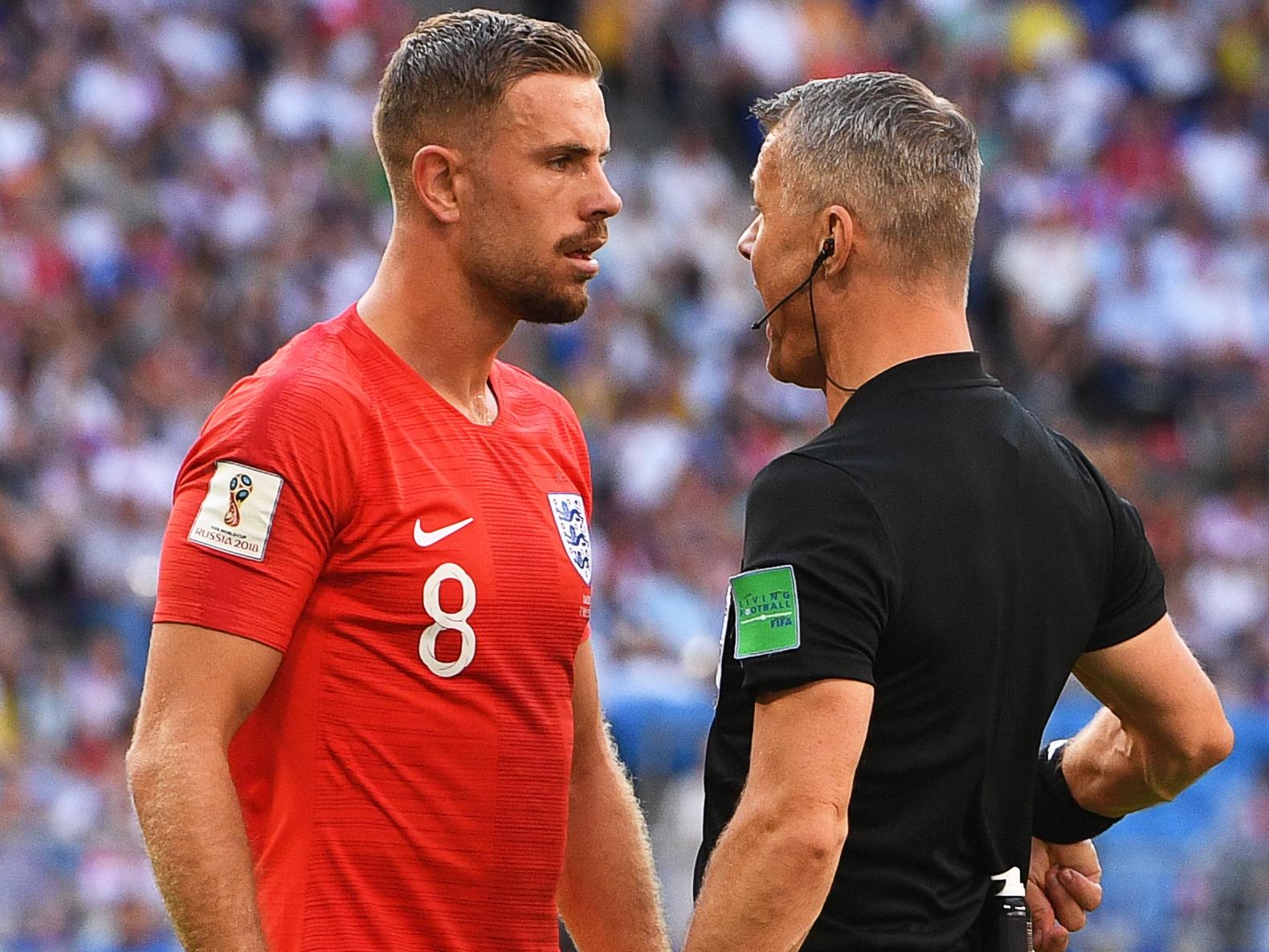 Jordan Henderson is given a telling off by referee Bjorn Kuipers