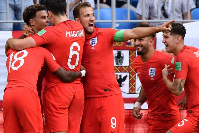 England's midfielder Dele Alli celebrates with England's forward Harry Kane