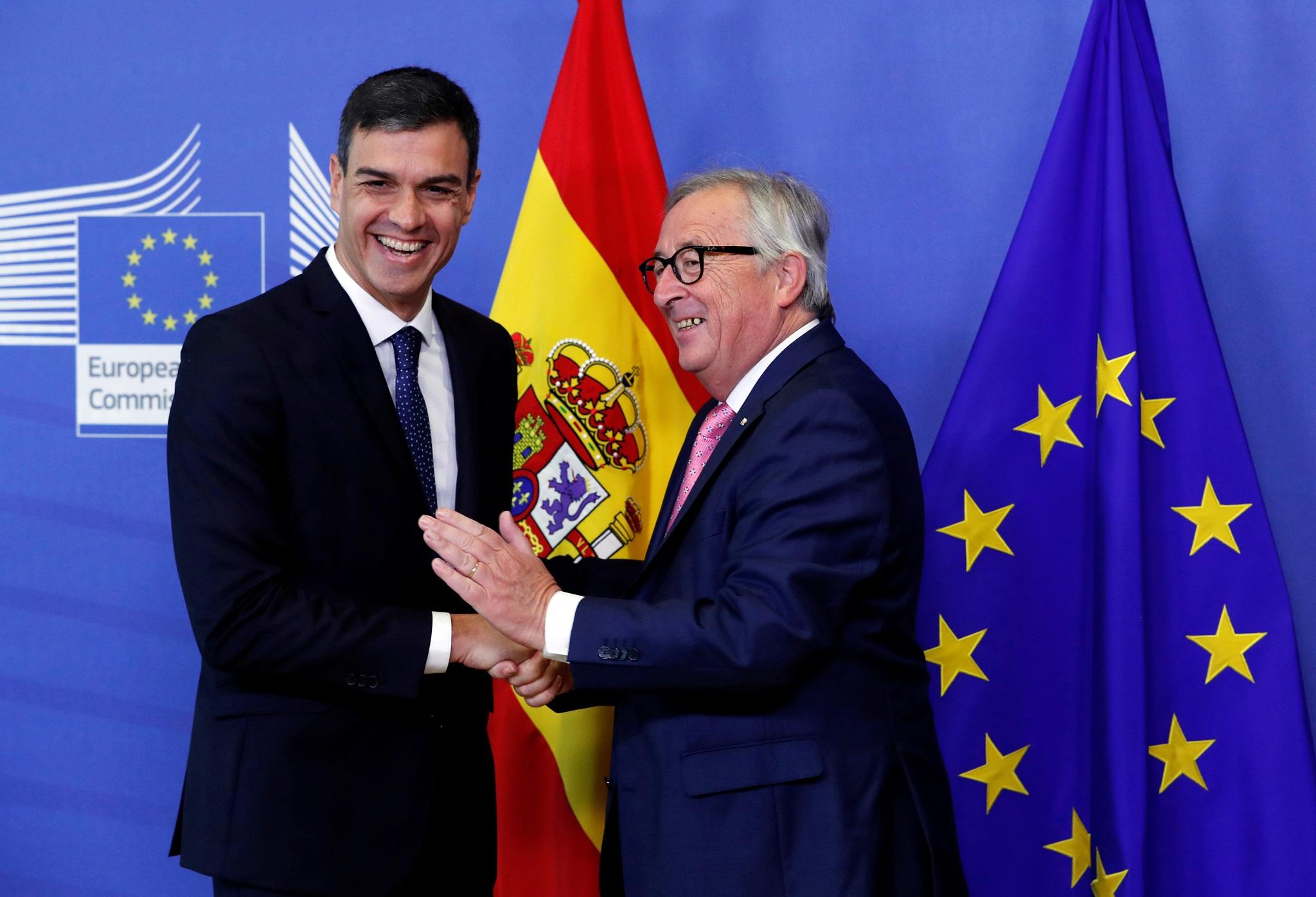 Spanish Prime Minister Pedro Sanchez is welcomed by European Commission President Jean-Claude Juncker