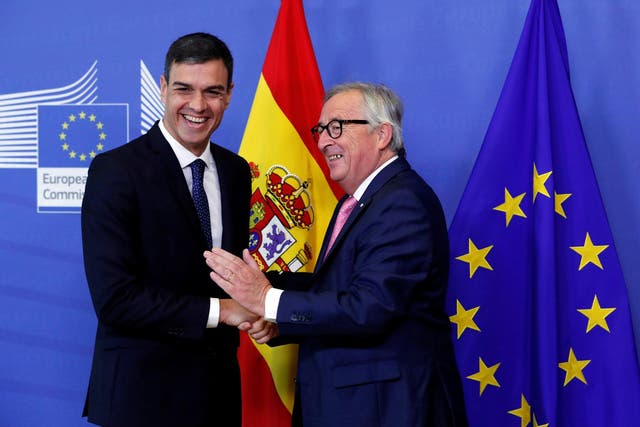 Spanish Prime Minister Pedro Sanchez is welcomed by European Commission President Jean-Claude Juncker
