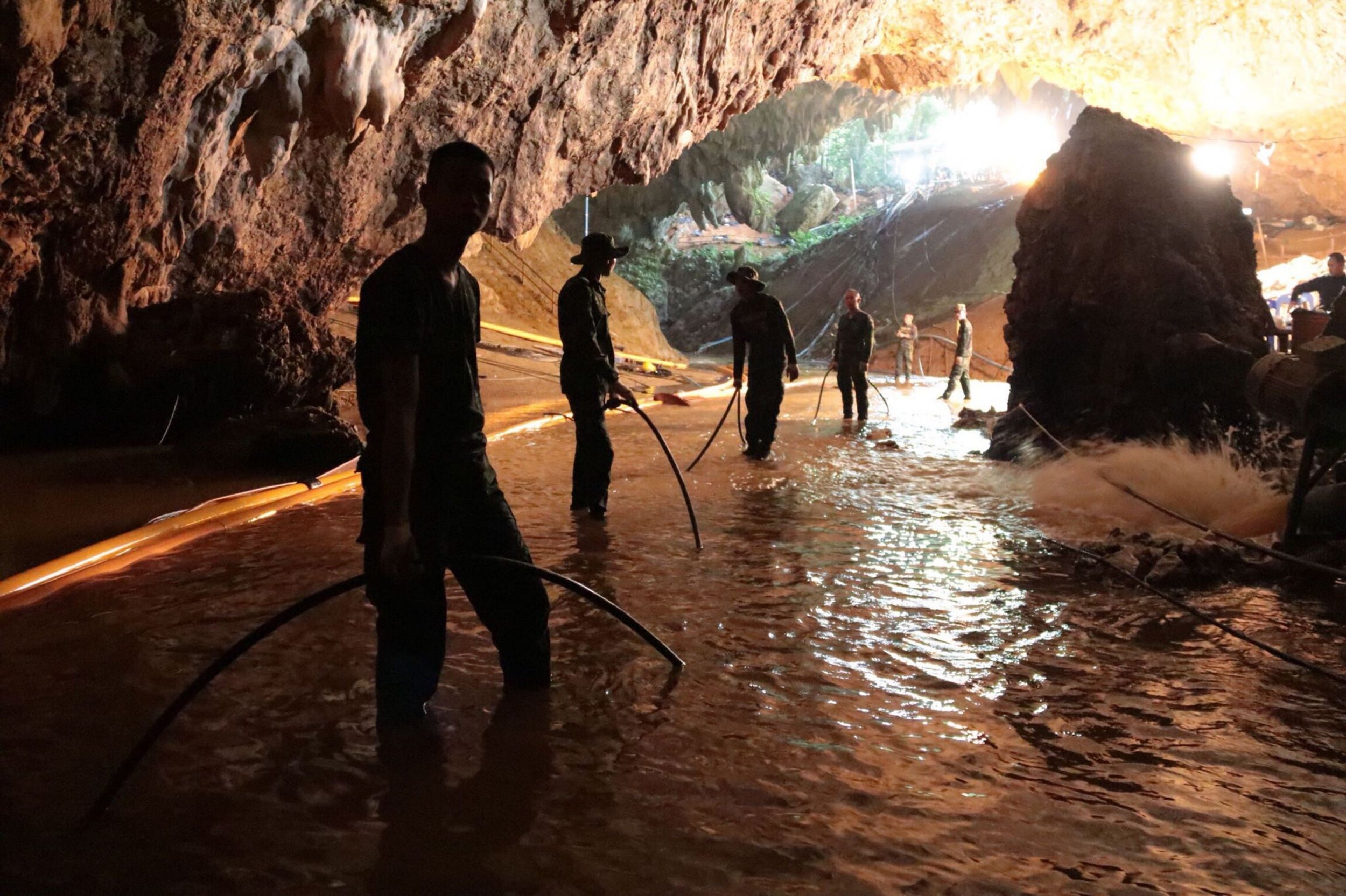 Thai navy soldiers try to drain the flooded cave