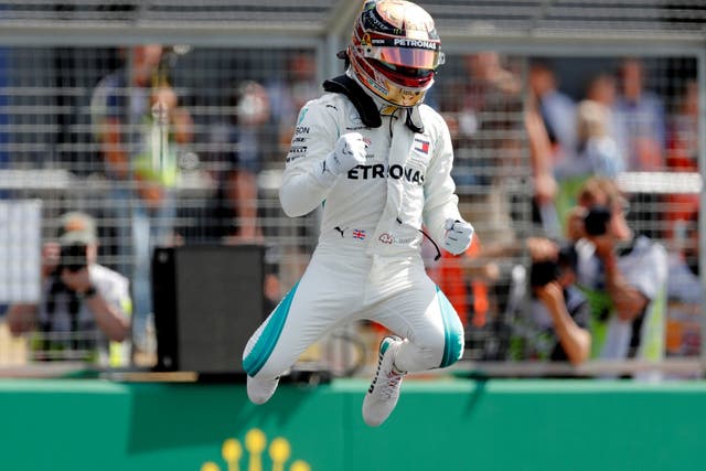 Lewis Hamilton punches the air after taking pole position for the British Grand Prix