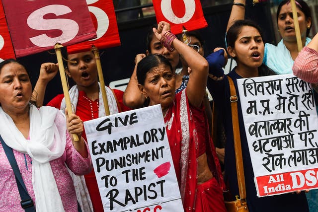 Indian women protest against the rape of an eight year old in in New Delhi