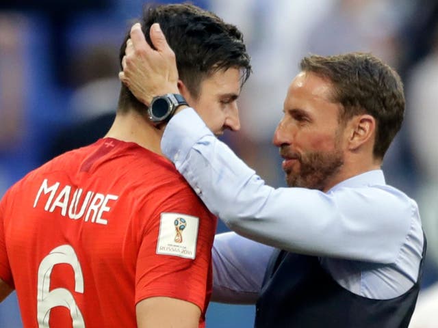 Harry Maguire is embraced by England manager Gareth Southgate