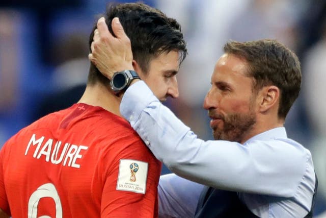 Harry Maguire is embraced by England manager Gareth Southgate