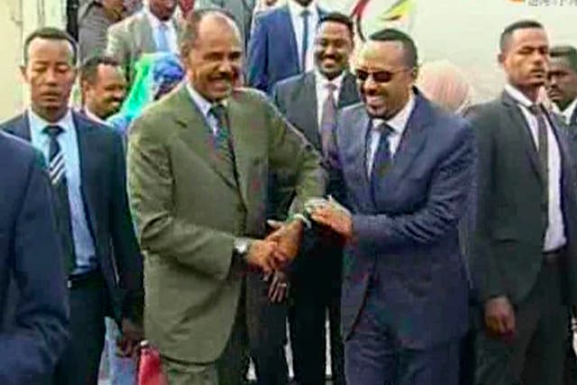 The moment was captured on live broadcast as Ethiopia's Prime Minister Abiy Ahmed, (centre right) was greeted at the airport by Eritrea's President Isaias Afwerki