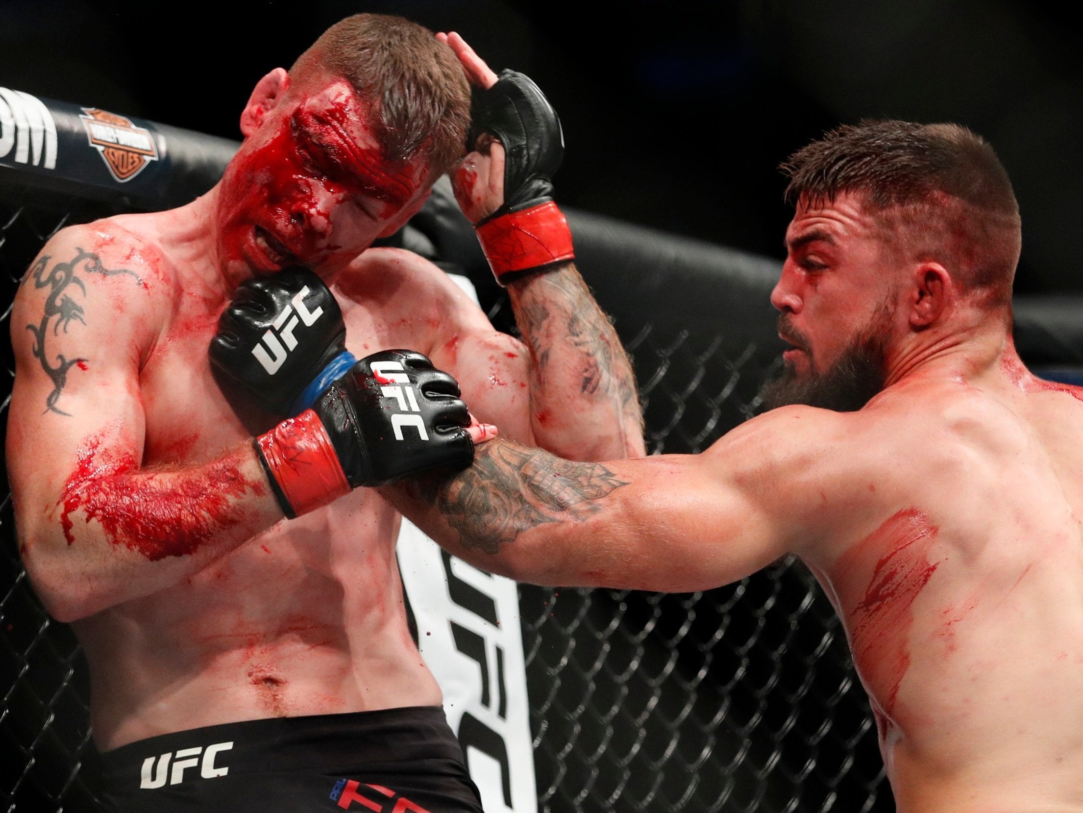 Mike Perry, right, hits Paul Felder during their welterweight bout at UFC 226