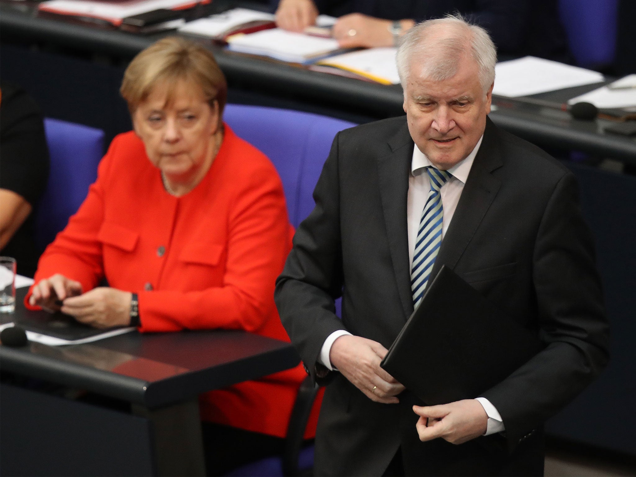 Horst Seehofer threatened to resign as interior minister at the height of his row over migration with Angela Merkel